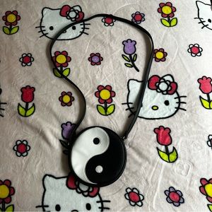 Leather yin yang crossbody bag